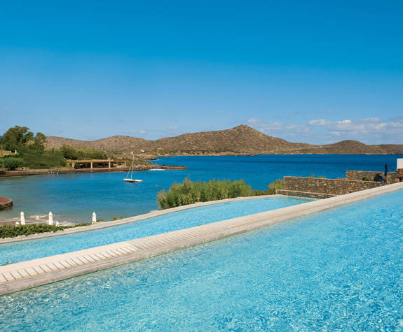 Elounda Bay Palace superior bungalows shared pool landscape view